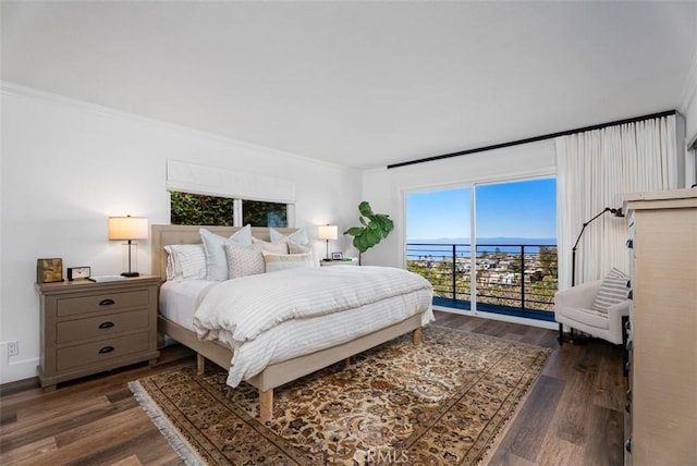 bedroom featuring baseboards, access to outside, dark wood-type flooring, and crown molding