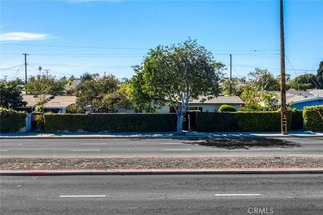 view of road with curbs and sidewalks