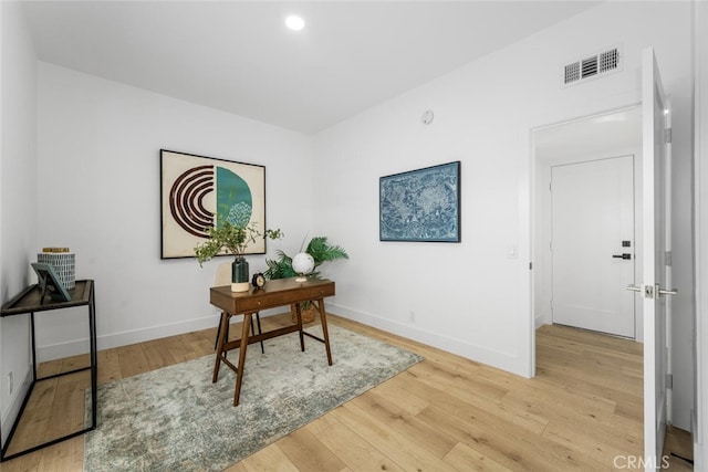 home office with recessed lighting, visible vents, baseboards, and wood finished floors