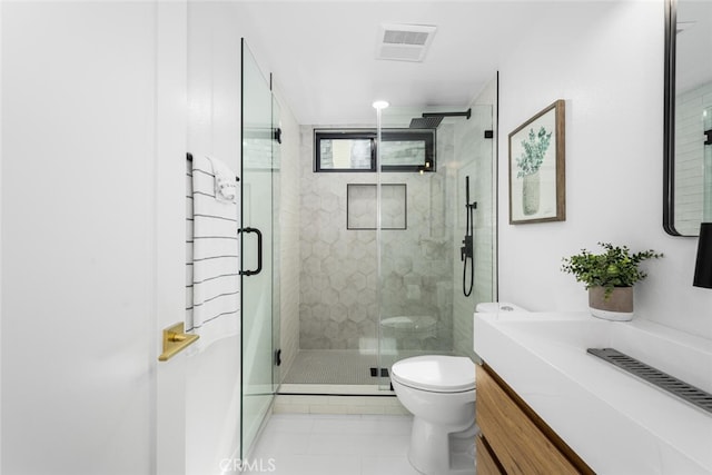 full bath with visible vents, toilet, tile patterned floors, vanity, and a shower stall