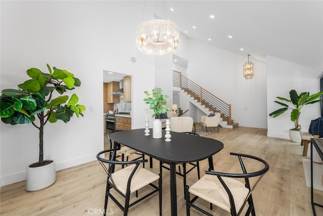 dining space with light wood finished floors, baseboards, stairs, a chandelier, and recessed lighting