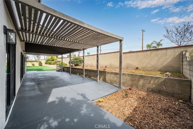 view of car parking featuring a fenced backyard