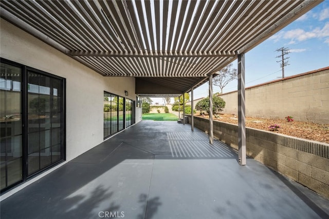 view of patio / terrace featuring fence