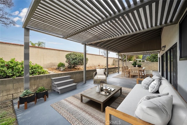 view of patio featuring a fenced backyard, outdoor lounge area, a pergola, and outdoor dining space