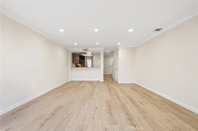 unfurnished living room with baseboards, visible vents, crown molding, light wood-style floors, and recessed lighting