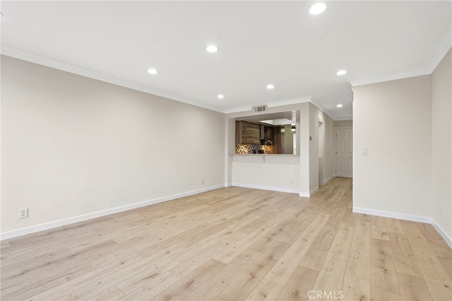 unfurnished living room with baseboards, recessed lighting, light wood-style flooring, and crown molding