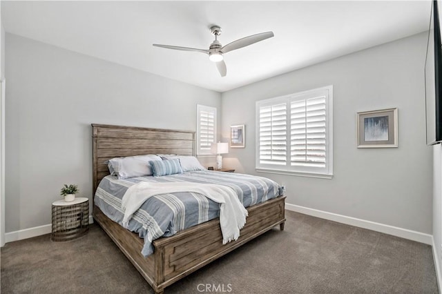 carpeted bedroom with ceiling fan and baseboards