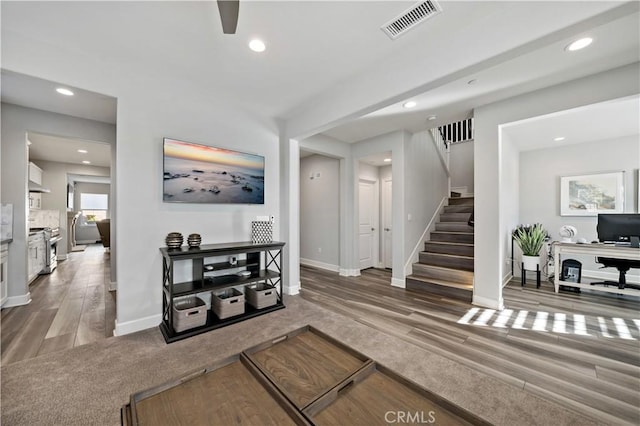 interior space featuring recessed lighting, visible vents, and stairs