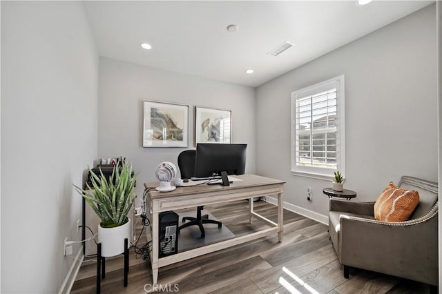 home office featuring recessed lighting, visible vents, baseboards, and wood finished floors