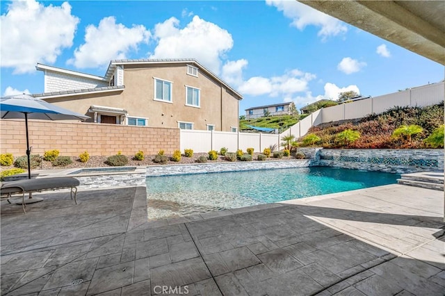 view of pool featuring a fenced in pool, a fenced backyard, and a patio