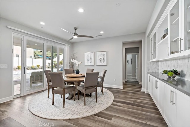 dining space featuring recessed lighting, dark wood-type flooring, a ceiling fan, baseboards, and visible vents