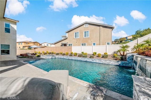 view of swimming pool with a fenced in pool, a fenced backyard, and a patio