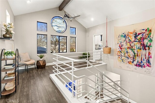 staircase with baseboards, recessed lighting, beamed ceiling, high vaulted ceiling, and wood-type flooring