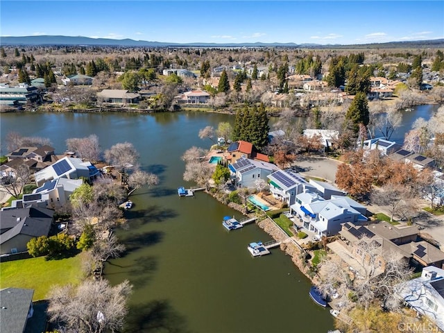 bird's eye view featuring a residential view and a water and mountain view