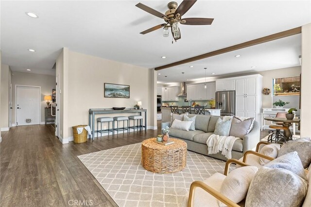 living room featuring recessed lighting, wood finished floors, a ceiling fan, and baseboards
