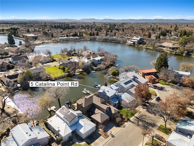 bird's eye view with a residential view and a water view