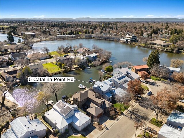 birds eye view of property with a residential view and a water and mountain view
