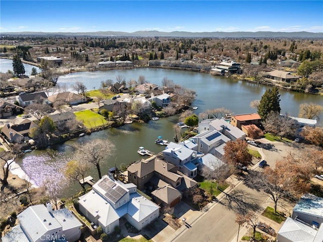 aerial view with a residential view and a water view