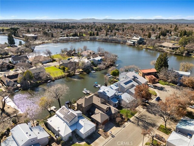 birds eye view of property with a residential view and a water and mountain view