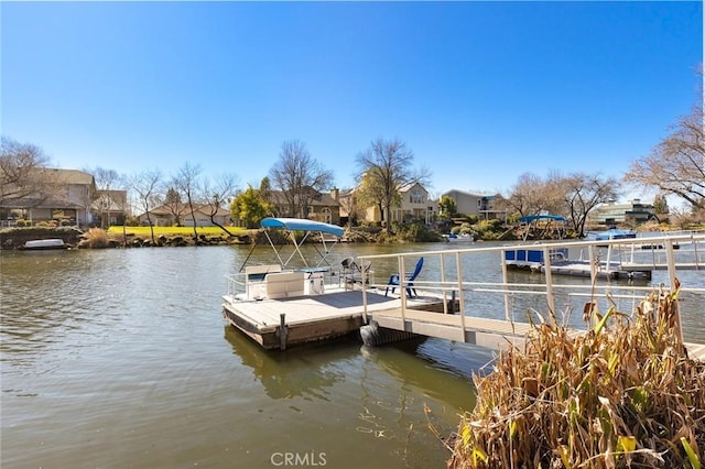 dock area featuring a water view and a residential view