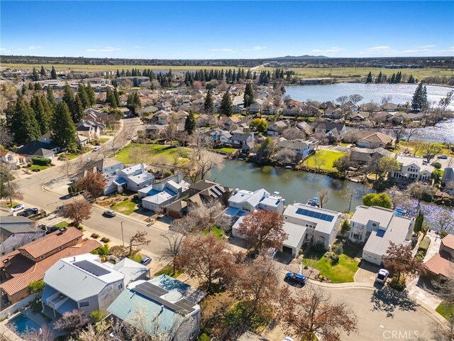 aerial view with a residential view and a water view