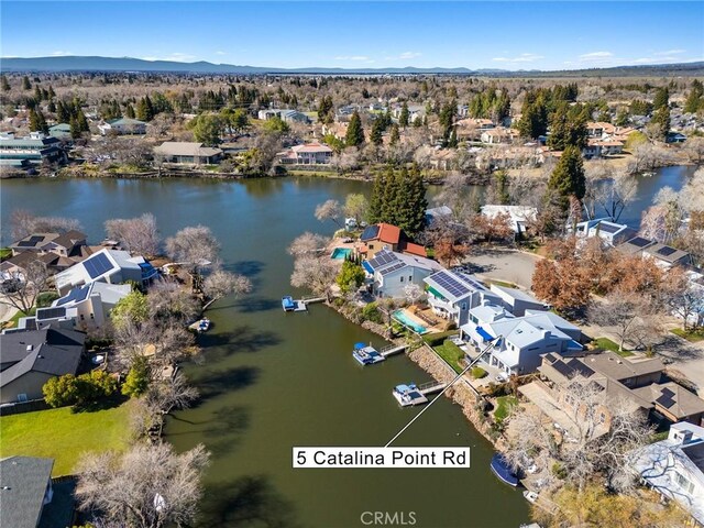 bird's eye view featuring a residential view and a water view