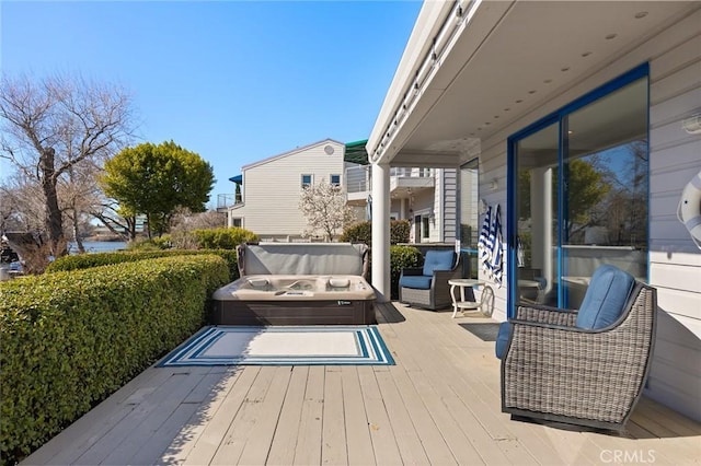 wooden terrace with a water view