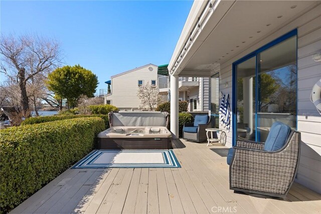 wooden deck featuring a water view