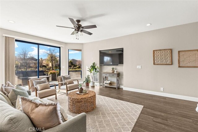 living room featuring recessed lighting, wood finished floors, baseboards, and ceiling fan