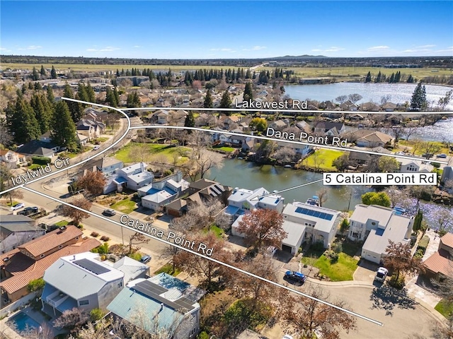 aerial view with a water view and a residential view