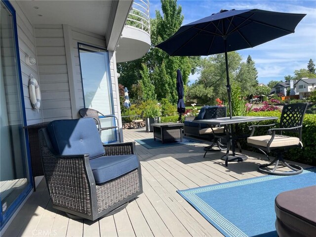 deck with an outdoor hangout area