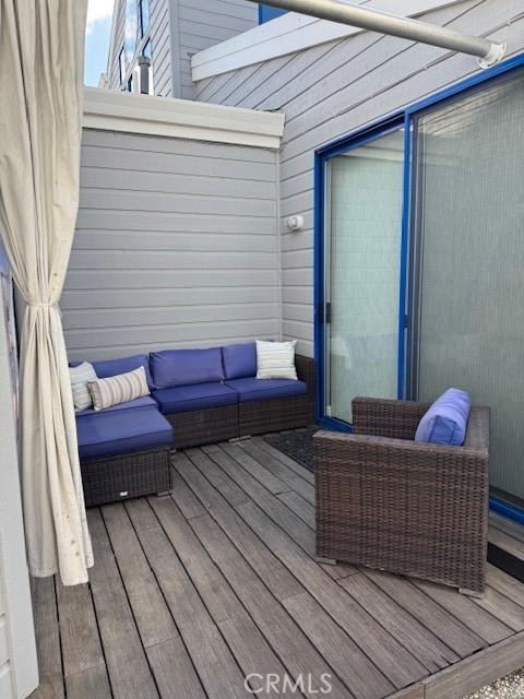 wooden deck featuring an outdoor hangout area