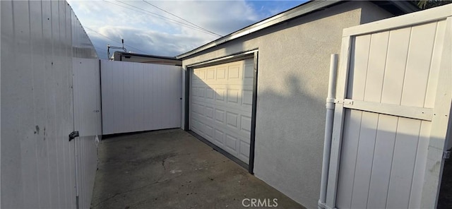 garage with fence