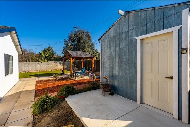 view of patio featuring a fenced backyard and a gazebo