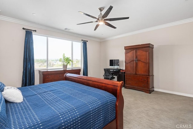 bedroom with ceiling fan, light colored carpet, visible vents, baseboards, and crown molding