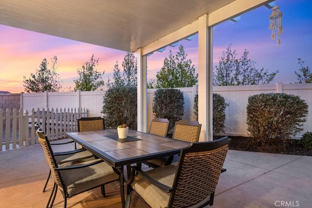 view of patio with a fenced backyard and outdoor dining space