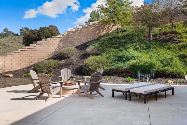 view of patio / terrace with an outdoor fire pit