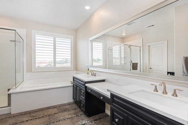 full bath featuring a stall shower, visible vents, a garden tub, and vanity