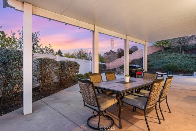 view of patio with outdoor dining space and a fenced backyard