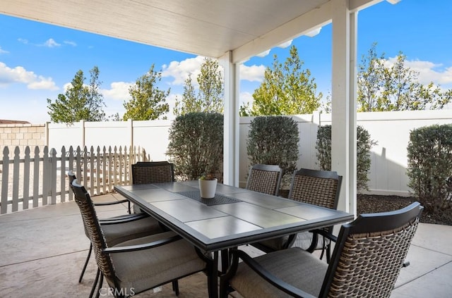 view of patio / terrace with a fenced backyard and outdoor dining area