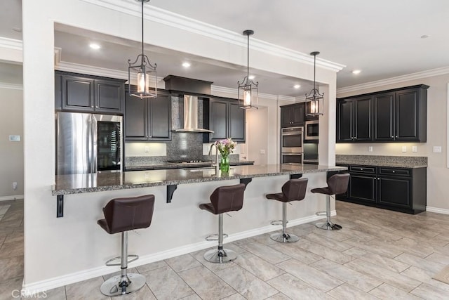 kitchen featuring stainless steel appliances, tasteful backsplash, a kitchen bar, dark stone countertops, and wall chimney exhaust hood