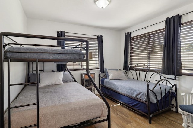 bedroom with wood finished floors