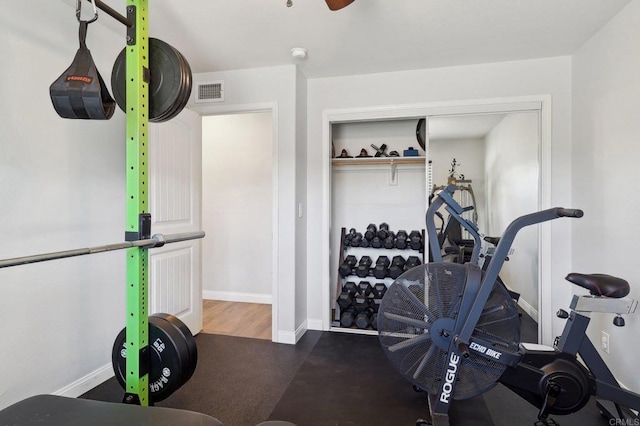 workout room featuring visible vents and baseboards