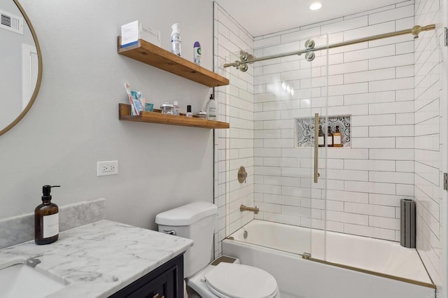 bathroom with enclosed tub / shower combo, visible vents, vanity, and toilet