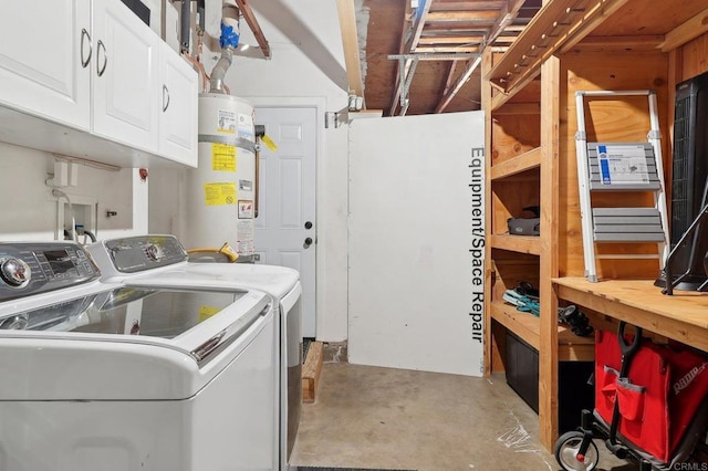 laundry room featuring cabinet space, washing machine and dryer, and strapped water heater