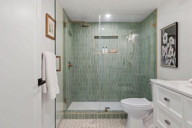 full bath with toilet, a shower stall, visible vents, and vanity