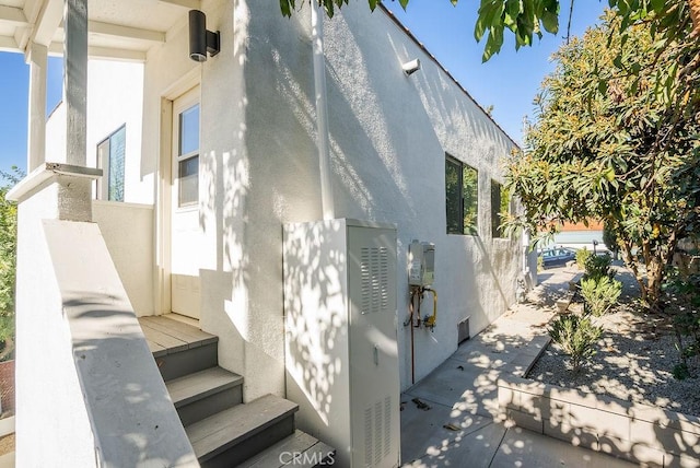 view of side of property with stucco siding