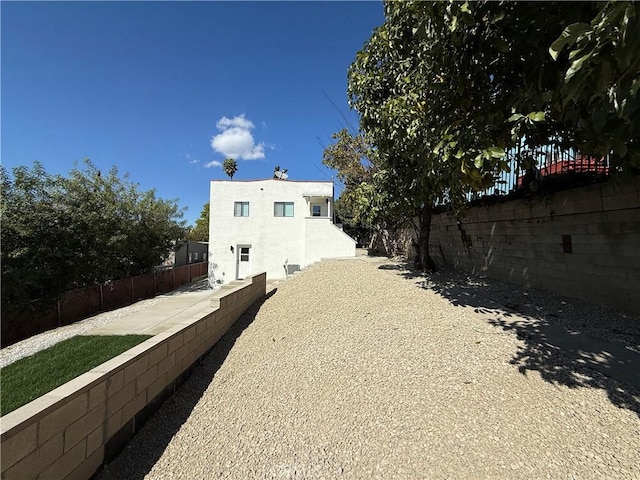 view of home's exterior featuring a fenced backyard and stucco siding