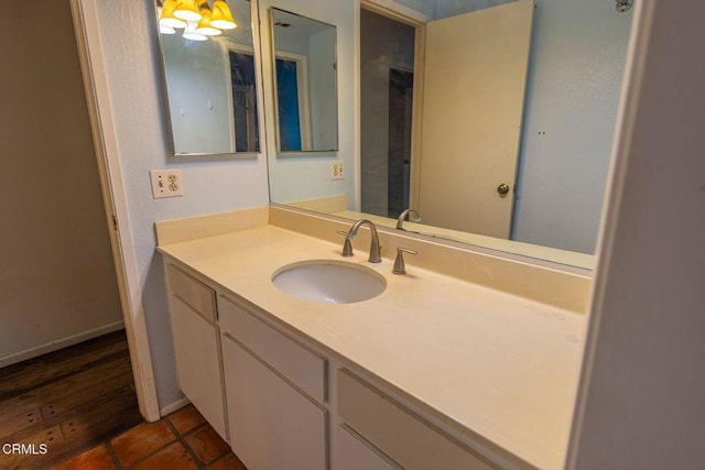 bathroom with vanity and baseboards