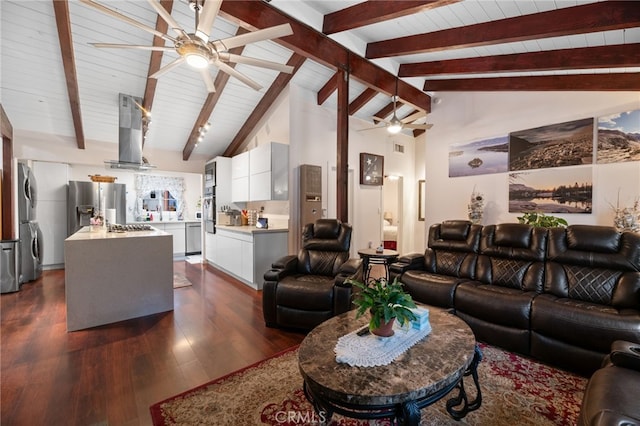 living room featuring a ceiling fan, stacked washer and clothes dryer, dark wood-style floors, high vaulted ceiling, and beam ceiling